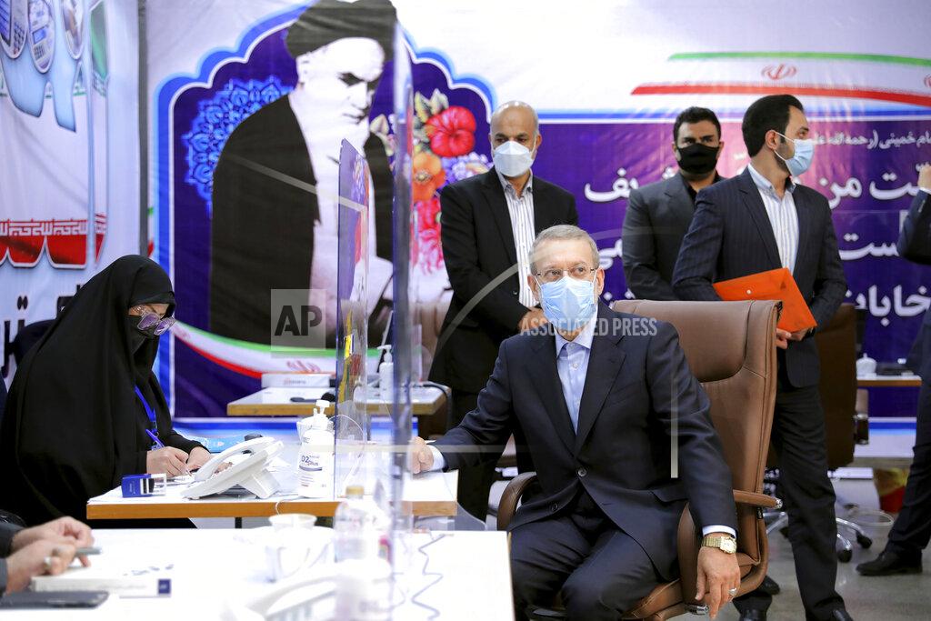 Ebrahim Noroozi Former Iranian parliament speaker Ali Larijani, front right, registers his name as a candidate for the June 18 presidential elections at the interior Ministry in Tehran, Iran, Saturday, May 15, 2021.(AP Photo/Ebrahim Noroozi)