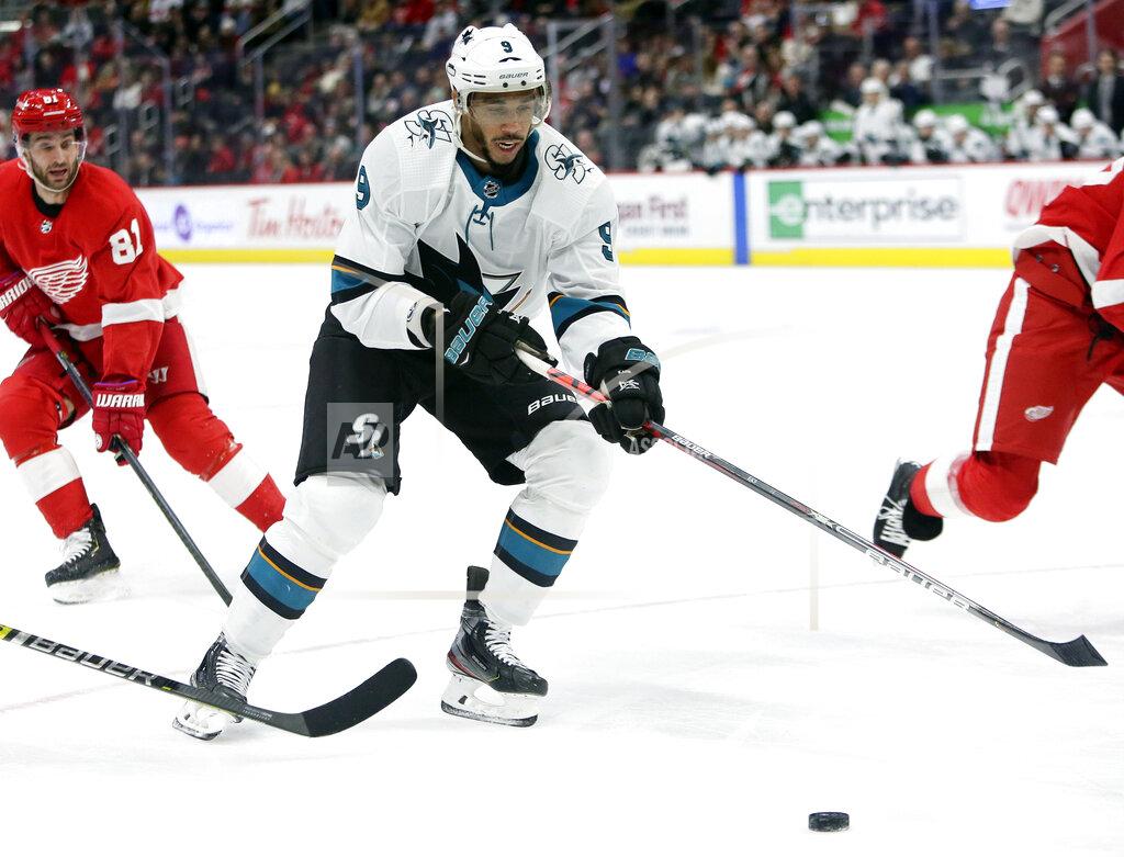 Duane Burleson File - In this Dec. 31, 2019, file photo, San Jose Sharks left wing Evander Kane (9) looks to pass the puck while being pursued by Detroit Red Wings center Frans Nielsen (81), of Denmark, during the first period of an NHL hockey game in Detroit. Seven current or former black NHL players have formed the Hockey Diversity Alliance to fight racism and intolerance in the sport. Akim Aliu and San Jose's Kane will lead the group, which also includes Trevor Daley, Matt Dumba, Wayne Simmonds, Chris Stewart and recently retired Joel Ward. (AP Photo/Duane Burleson, File)