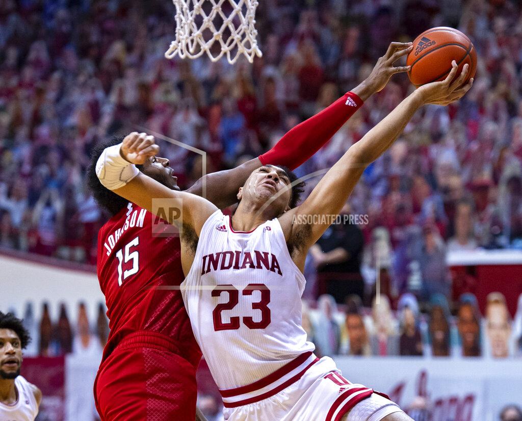 Doug Mcschooler Indiana forward Trayce Jackson-Davis, right, has his shot attempt blocked by Rutgers center Myles Johnson, left, during the second half of an NCAA college basketball game, Sunday, Jan. 24, 2021, in Bloomington, Ind. (AP Photo/Doug McSchooler)