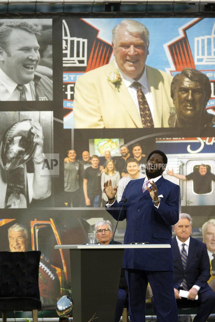 D. Ross Cameron Former Oakland Raiders player Henry Lawrence sings "Amazing Grace" during a memorial service for former NFL football coach and television commentator John Madden, Monday, Feb. 14, 2022, in Oakland, Calif. Madden died last year at age 85. (AP Photo/D. Ross Cameron)