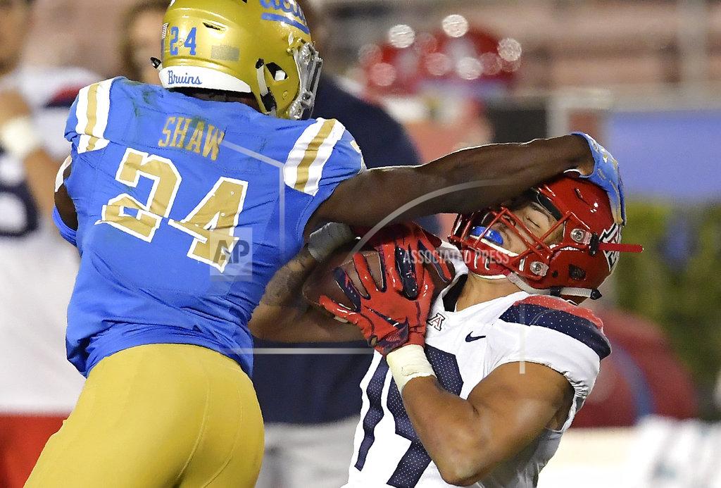 Mark J. Terrill Arizona wide receiver Shawn Poindexter, right, makes a catch as UCLA defensive back Jay Shaw defends during the second half of an NCAA college football game Saturday, Oct. 20, 2018, in Pasadena, Calif. UCLA won 31-30. (AP Photo/Mark J. Terrill)