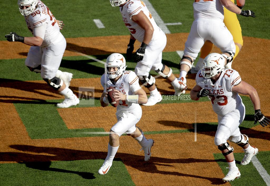 Nick Wagner Texas quarterback Sam Ehlinger (11) scrambles with the ball against Baylor during an NCAA college football game on Saturday, Nov. 23, 2019, in Waco, Texas. (Nick Wagner/Austin American-Statesman via AP)