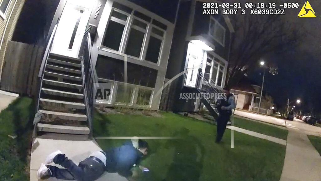 Uncredited In this image taken from Chicago Police body cam video from early Wednesday, March 31, 2021, Anthony Alvarez lies on the ground after a police foot chase in Chicago. Alvarez was fatally shot by police during the incident. Police claim Alvarez, 22, brandished a gun while being chased. (Civilian Office of Police Accountability via AP)
