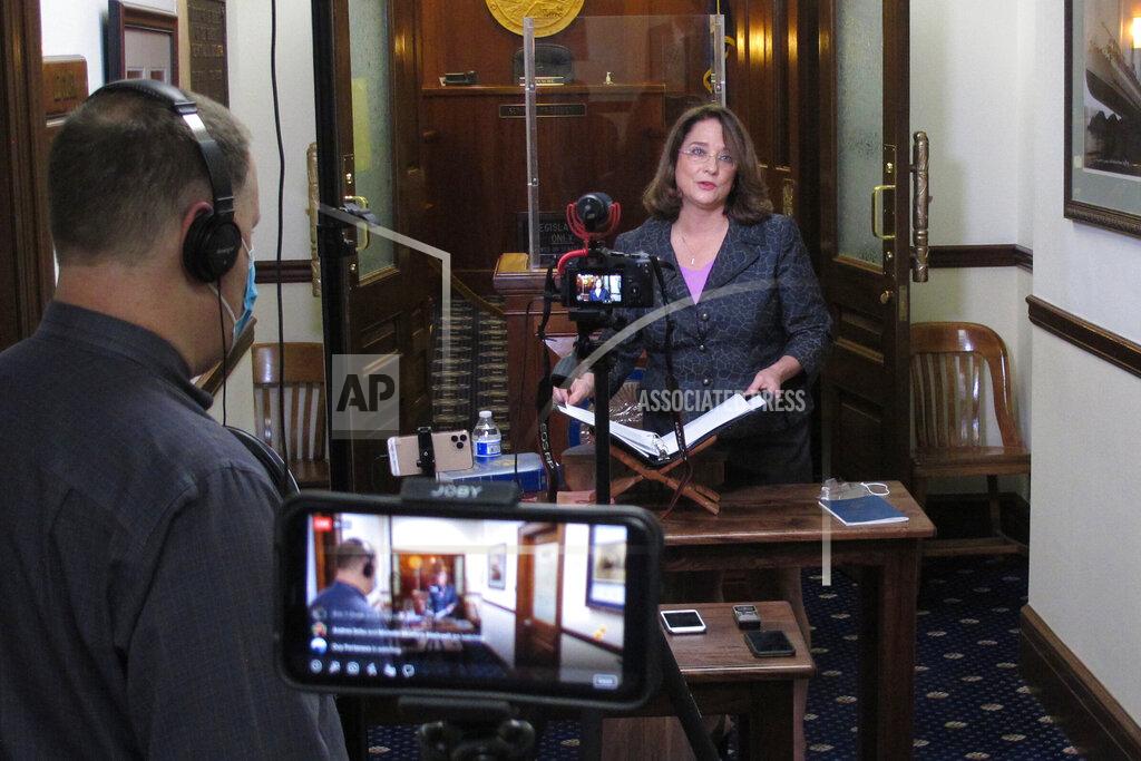 Alaska state Sen. Lora Reinbold holds a news conference outside the Senate chambers in the Alaska Capitol on Thursday, March 4, 2021, in Juneau, Alaska. Reinbold said she wants an apology from Gov. Mike Dunleavy, a fellow Republican, after he sent her a letter last month accusing her of misrepresenting the state's COVID-19 response. A Dunleavy spokesperson said the governor will not be retracting his letter to Reinbold. (AP Photo/Becky Bohrer)