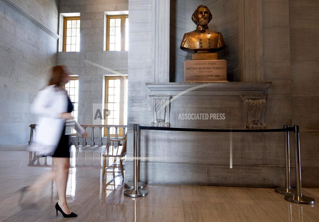 George Walker Iv A capitol employee walks past a bust of Confederate general and early Ku Klux Klan leader Nathan Bedford Forrest at the State Capitol Thursday, July 22, 2021, in Nashville, Tenn. A decadeslong effort to remove the bust from the Tennessee Capitol cleared its final hurdle Thursday, with state leaders approving the final vote needed to allow the statue to be relocated to a museum. (George Walker IV/The Tennessean via AP)