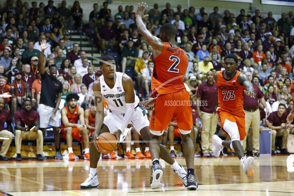 Marco Garcia Michigan State forward Aaron Henry (11) tries to get around Virginia Tech guard Landers Nolley II (2) during the first half of an NCAA college basketball game Monday, Nov. 25, 2019, in Lahaina, Hawaii. (AP Photo/Marco Garcia)