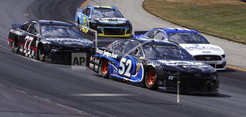 Charles Krupa Austin Theriault (52) goes into Turn 1 with traffic during a NASCAR Cup Series auto race at New Hampshire Motor Speedway in Loudon, N.H., Sunday, July 21, 2019. (AP Photo/Charles Krupa)