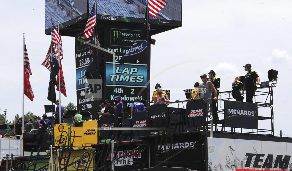 Charles Krupa Teams watch racers from the roof of their haulers during a NASCAR Cup Series auto race practice at New Hampshire Motor Speedway in Loudon, N.H., Saturday, July 20, 2019. (AP Photo/Charles Krupa)