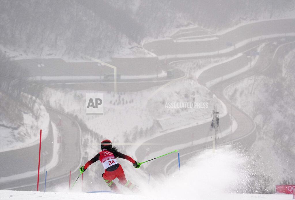 Robert F. Bukaty Kong Fanying of China passes a gate at the 2022 Winter Olympics, Thursday, Feb. 17, 2022, in the Yanqing district of Beijing. (AP Photo/Robert F. Bukaty)