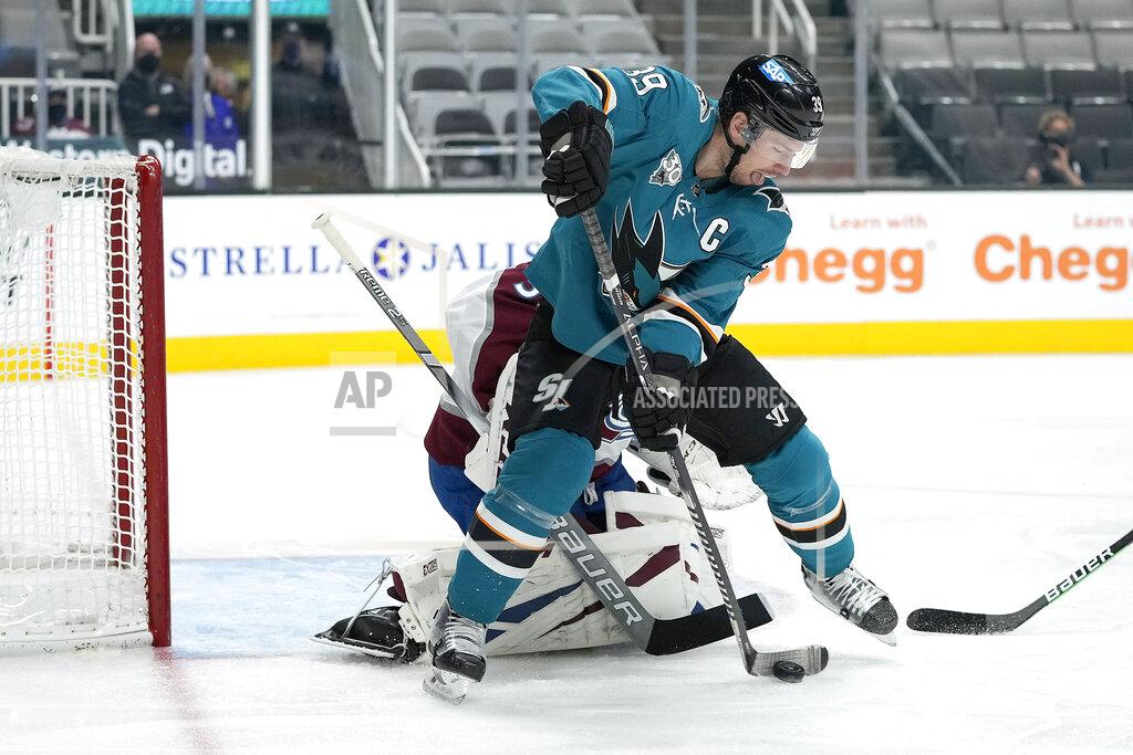 Tony Avelar San Jose Sharks center Logan Couture (39) tries to score against Colorado Avalanche goaltender Philipp Grubauer (31) during the first period of an NHL hockey game in San Jose, Calif., on Wednesday, May 5, 2021. (AP Photo/Tony Avelar)