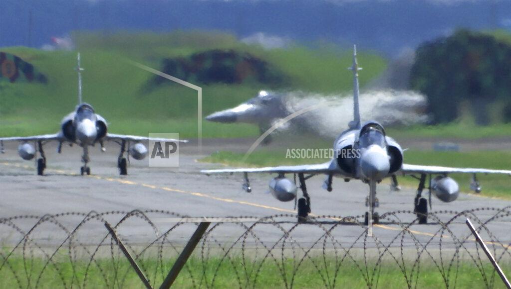 Johnson Lai Taiwan Air Force Mirage fighter jets taxi on a runway at an airbase in Hsinchu, Taiwan, Friday, Aug. 5, 2022. China says it summoned European diplomats in the country to protest statements issued by the Group of Seven nations and the European Union criticizing threatening Chinese military exercises surrounding Taiwan. (AP Photo/Johnson Lai)