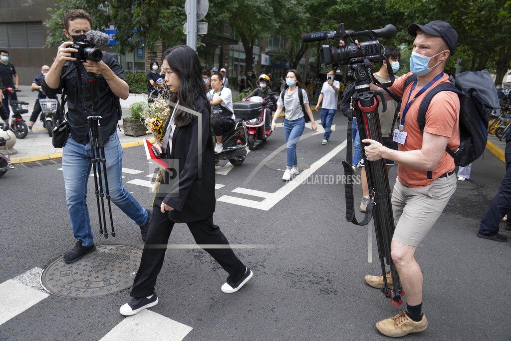 Mark Schiefelbein Zhou Xiaoxuan, a former intern at China's state broadcaster CCTV, arrives to attend a court session at a courthouse in Beijing, Tuesday, Sept. 14, 2021. Zhou became the face of the country's MeToo movement after going public with accusations against a prominent CCTV host in 2018. Since then, even as the movement was shut down by authorities, Zhou has continued to speak out. (AP Photo/Mark Schiefelbein)
