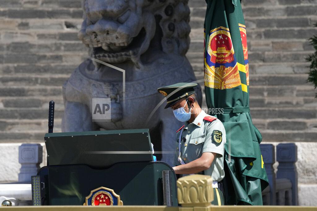 Ng Han Guan A Chinese paramilitary policeman guards on duty near Tiananmen Square on the 32nd anniversary of a deadly crackdown on pro-democracy protests in Beijing on Friday, June 4, 2021. Commemorations of the June 4, 1989 crackdown on student-led pro-democracy protests centered on Beijing's Tiananmen Square were especially muted Friday amid pandemic control restrictions and increasing political repression. (AP Photo/Ng Han Guan)