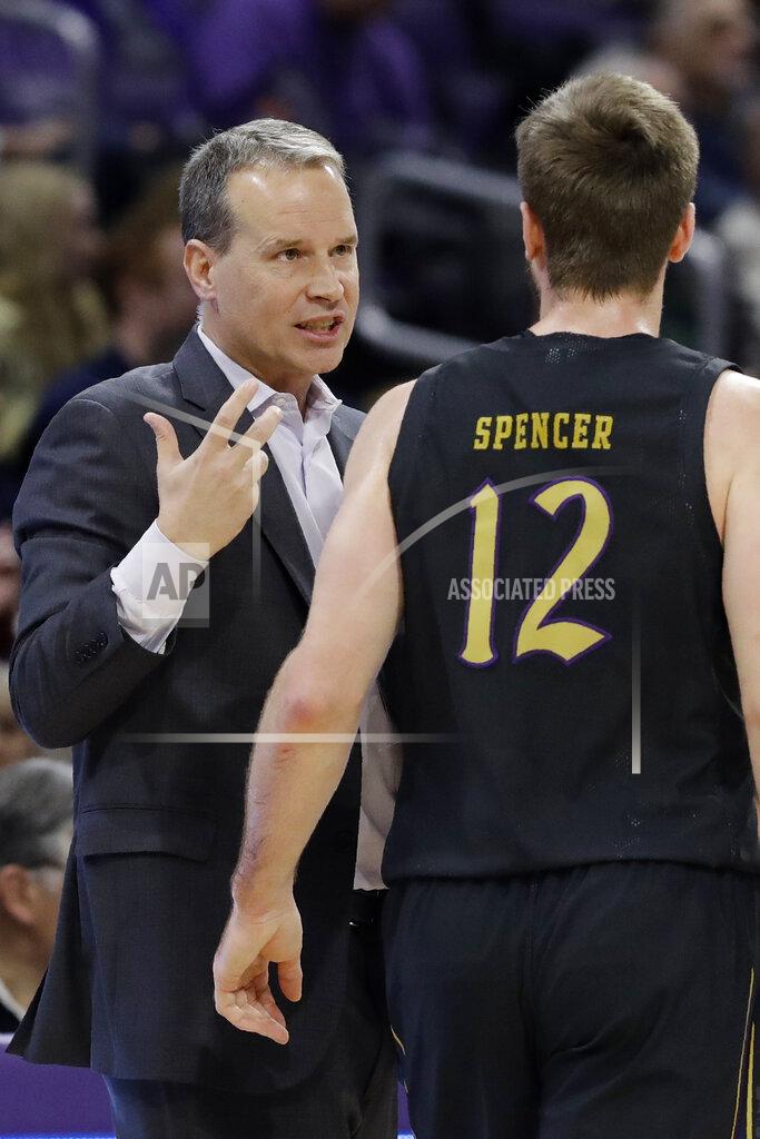 Nam Y. Huh Northwestern head coach Chris Collins, left, talks with guard Pat Spencer during the first half of an NCAA college basketball game against Michigan in Evanston, Ill., Wednesday, Feb. 12, 2020. (AP Photo/Nam Y. Huh)