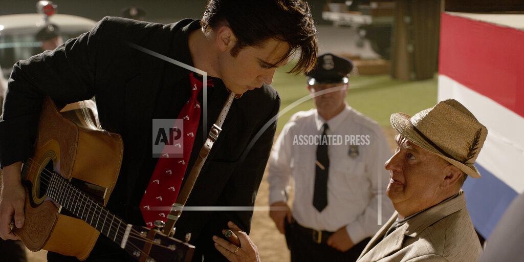 Uncredited This image released by Warner Bros. Pictures shows Austin Butler and Tom Hanks in a scene from "Elvis." (Warner Bros. Pictures via AP)