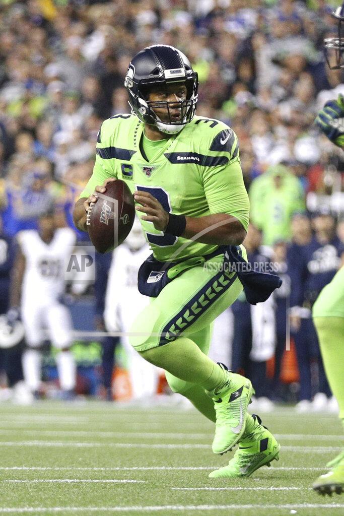 Margaret Bowles Seattle Seahawks quarterback Russell Wilson (3) looks downfield for a receiver in an NFL game against the Los Angeles Rams, Thursday, Oct. 3, 2019, in Seattle. The Seahawks defeated the Rams 30-29. (Margaret Bowles via AP)