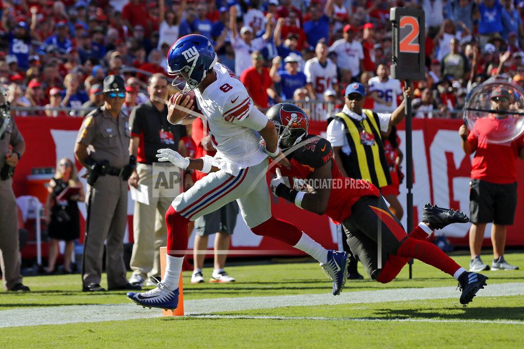 Mark Lomoglio New York Giants quarterback Daniel Jones (8) beats Tampa Bay Buccaneers cornerback M.J. Stewart (36) to the endzone to score during the first half of an NFL football game Sunday, Sept. 22, 2019, in Tampa, Fla. (AP Photo/Mark LoMoglio)