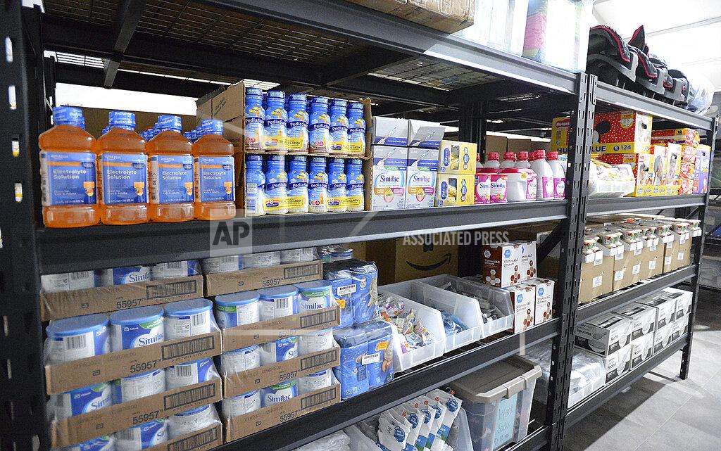 Randy Hoeft Shelves inside a storage room are stocked with items for infants during an open house at the U.S. Border Patrol Yuma Sector processing facility Tuesday, April 20, 20201, in Yuma, Ariz. (Randy Hoeft/The Yuma Sun via AP)