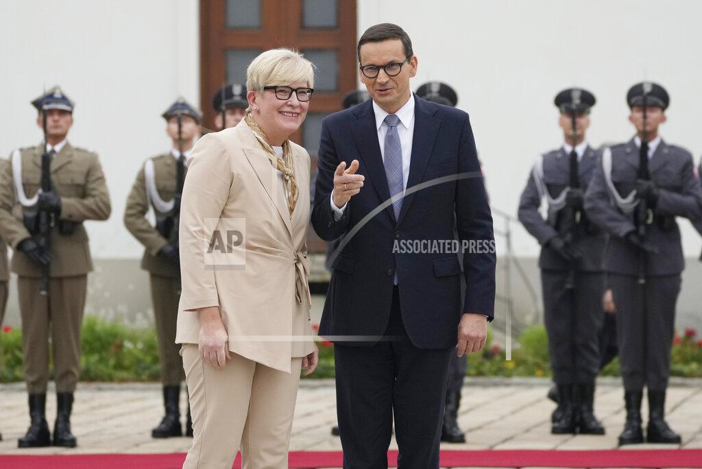 Czarek Sokolowski Lithuanian Prime Minister Ingrida Simonyte, left, being greeted by Poland's Prime Minister Mateusz Morawiecki on a visit for talks that include the region's security in the face of migrant pressure on the two countries' borders with Belarus, in Warsaw, Poland, on Friday, Sept. 17, 2021. (AP Photo/Czarek Sokolowski)
