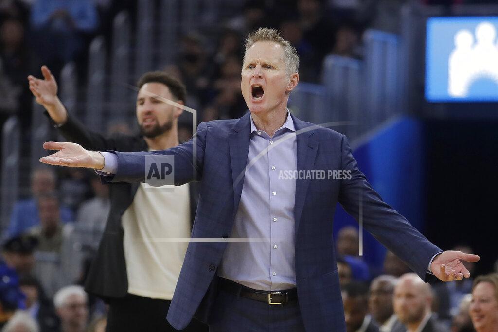 Jeff Chiu FILE - In this Dec. 28, 2019, file photo, Golden State Warriors head coach Steve Kerr, foreground, and injured guard Klay Thompson react to an official's call during the first half of an NBA basketball game against the Dallas Mavericks in San Francisco. It feels like so long ago that the Golden State Warriors even played a game. They missed going to the bubble in Florida, so it has been nine months. (AP Photo/Jeff Chiu, File)