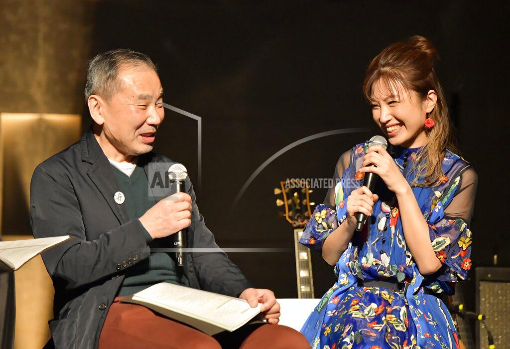 In this photo provided by TOKYO FM, Japanese author Haruki Murakami, left, talks with guitarist Kaori Muraji during a show in Tokyo Sunday, Feb. 14, 2021. Murakami has a remedy for those who need relaxation from stress and worries in time of a pandemic - Brazilian Bossa nova music. During the approximately two-hour show, he recited his 1982 short story “The1963/1982 Girl from Ipanema,” in which a narrator details his memory of his meeting with a metaphysical girl from the song, with live guitar performed by his guest Muraji. (TOKYO FM via AP)