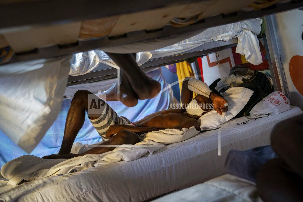 Emilio Morenatti Hady Baye, 31, rests in a bunk bed at the Modern Christian Mission Church in Fuerteventura, one of the Canary Islands, Spain, on Saturday, Aug. 22, 2020. The Modern Christian Mission is the main shelter for rescued migrants on the island of Fuerteventura. Some 4,000 migrants have reached the Canaries so far this year, the most in over a decade, raising alarm at the highest levels of the Spanish government. (AP Photo/Emilio Morenatti)