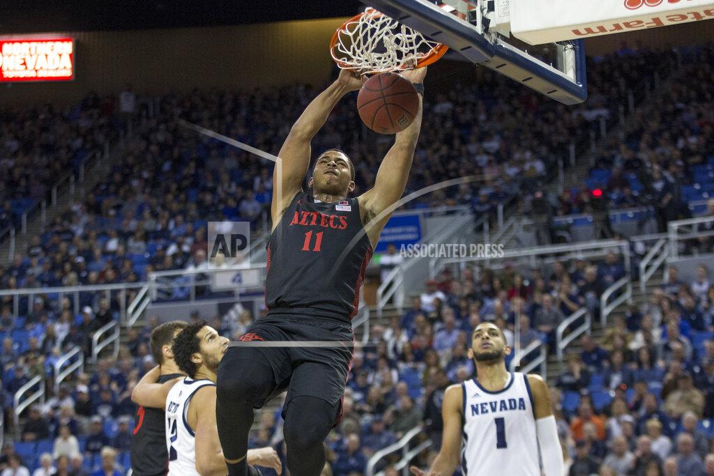 Tom R. Smedes San Diego State forward Matt Mitchell (11) dunks the ball during the first half of an NCAA college basketball game against Nevada in Reno, Nev., Saturday, Feb. 29, 2020. (AP Photo/Tom R. Smedes)