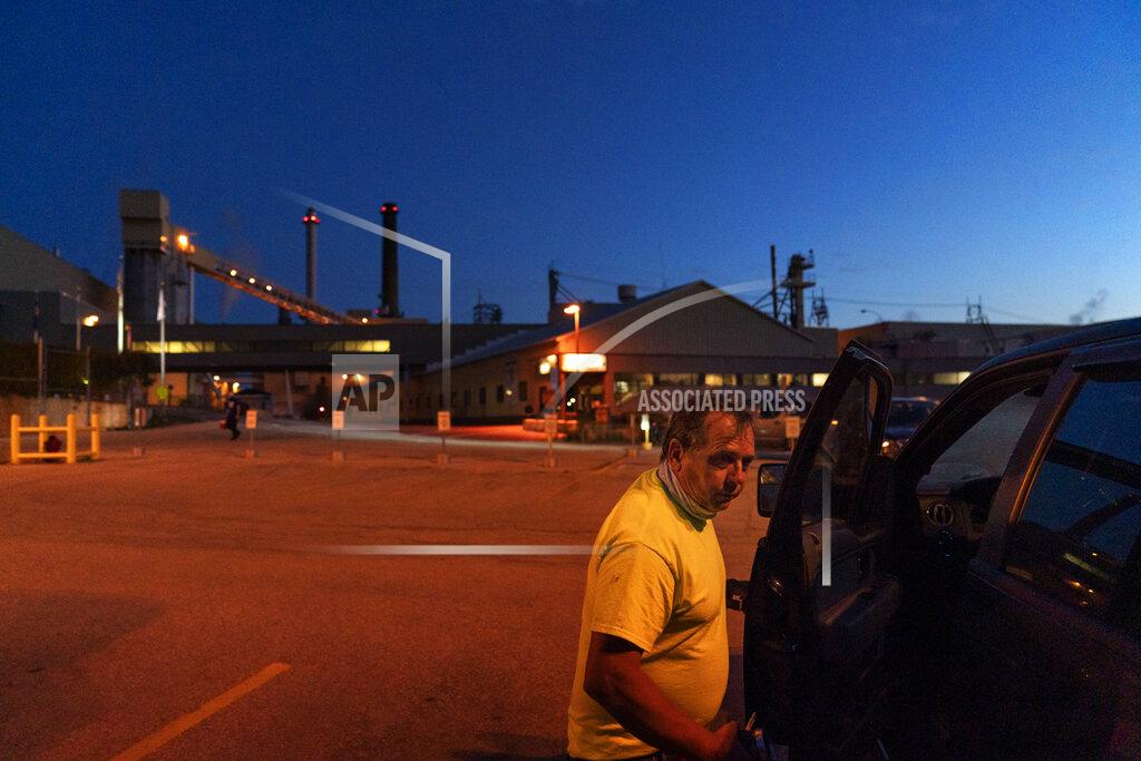 David Goldman Tom Becker leaves after an overnight shift at the Midwest Paper Group mill in Little Chute, Wis., part of the greater Appleton area where nearly one in five jobs are still in factories Aug. 18, 2020. Between 2001 and 2016, Wisconsin's paper industry lost 15,000 jobs. (AP Photo/David Goldman)