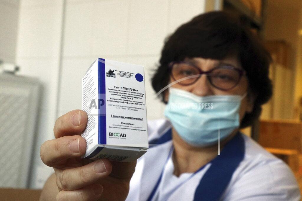 Janos Vajda A pharmacist holds a packet of Sputnik V vaccines to be used for the first dose in the pharmacy of the Borsod-Abauj-Zemplen County Medical Center and University Teaching Hospital in Miskolc, Hungary, Tuesday, March 9, 2021. (Janos Vajda/MTI via AP)
