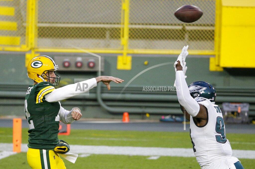 Mike Roemer Green Bay Packers' Aaron Rodgers throws a pass during the first half of an NFL football game against the Philadelphia Eagles Sunday, Dec. 6, 2020, in Green Bay, Wis. (AP Photo/Mike Roemer)