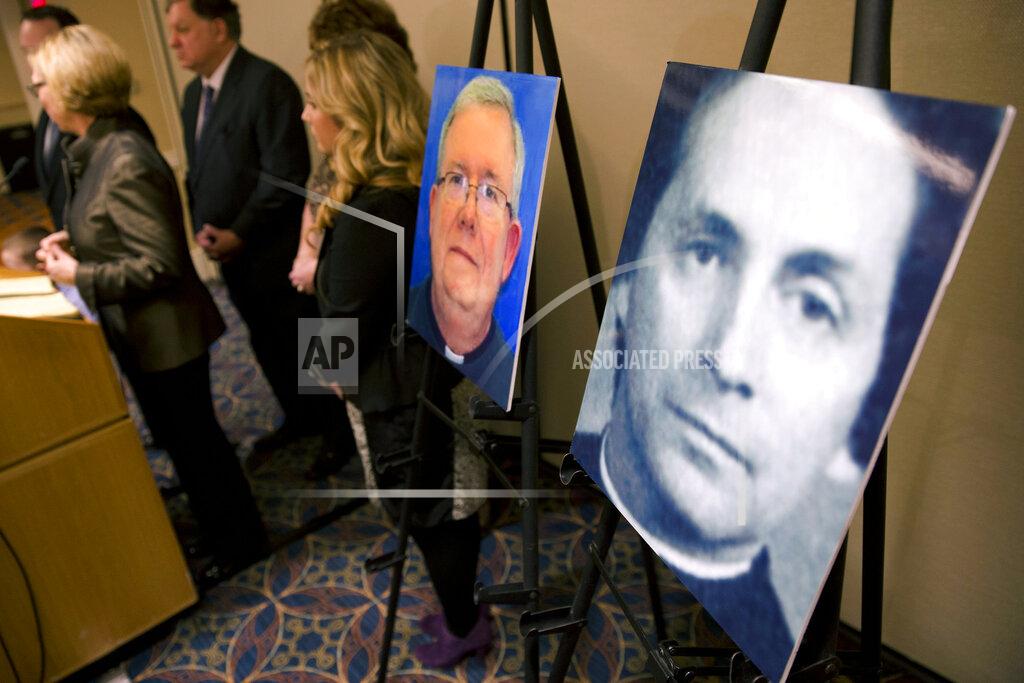 Matt Rourke FILE - In this Nov. 13, 2013, file photo, a photo of Rev. Robert Brennan, right, is displayed during a news conference in Philadelphia. Federal prosecutors in Philadelphia charged Brennan, a former Roman Catholic priest with lying to the FBI about whether he knew the accuser and his family. Two years ago U.S. attorney William McSwain in Philadelphia joined the long line of ambitious prosecutors investigating the Roman Catholic church's handling of priest-abuse complaints. The Justice Department had never brought a conspiracy case against the church. McSwain sent subpoenas to dioceses across Pennsylvania asking them to turn over their files and submit to grand jury testimony if asked. The dioceses pledged to comply. But as McSwain's tenure nears its end as President-elect Joe Biden takes office next month, there's no sign that any sweeping church indictment is afoot. (AP Photo/Matt Rourke, File)