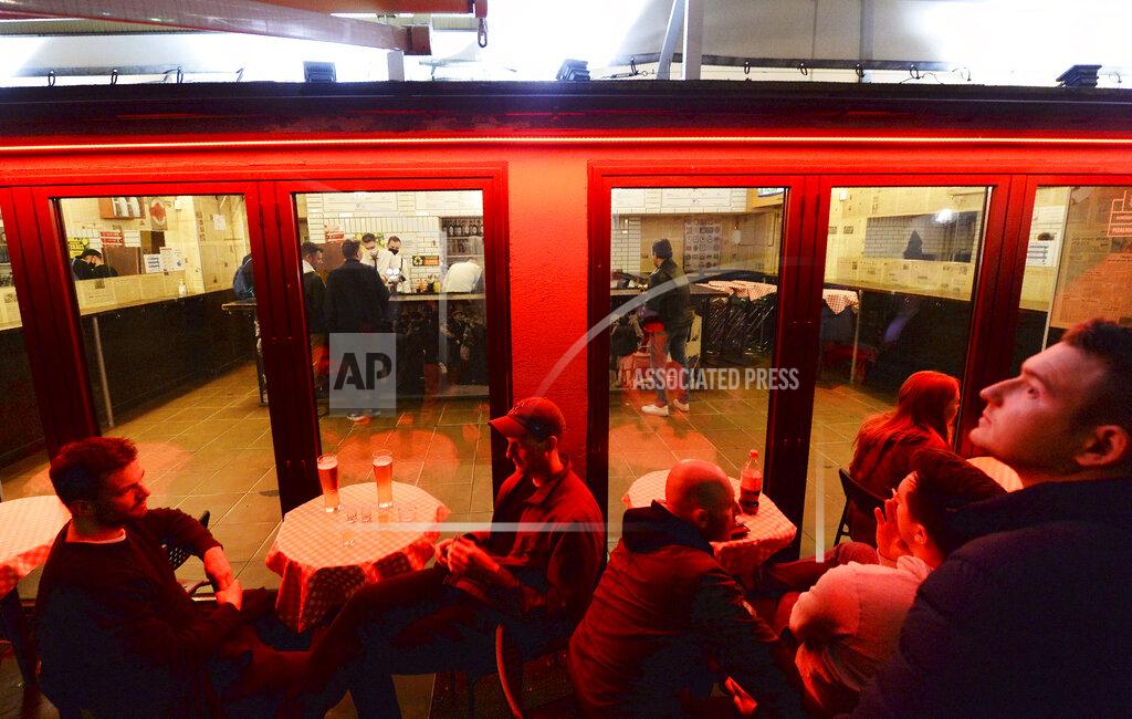 Czarek Sokolowski People gather and celebrate as bars, clubs and other establishments reopened in Poland after being closed for seven months, in Warsaw, Poland, Friday, May 14, 2021.(AP Photo/Czarek Sokolowski)