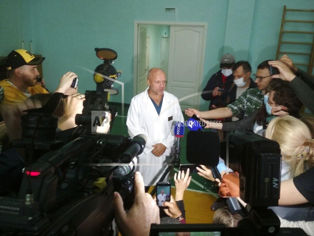 Evgeniy Sofiychuk Anatoliy Kalinichenko, deputy chief doctor of the Omsk hospital of intensive care where Alexei Navalny is hospitalized speaks to the media in Omsk, Russia, Thursday, Aug. 20, 2020. Russian opposition politician Alexei Navalny is on a hospital ventilator in a coma, after falling ill from a suspected poisoning, according to his spokeswoman Kira Yarmysh. (AP Photo/Evgeniy Sofiychuk)