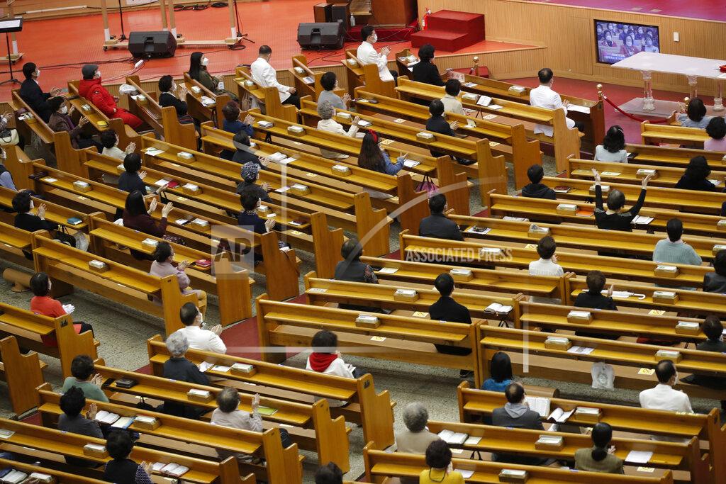 Lee Jin-Man Christians wearing face masks as a precaution against the coronavirus attend while maintaining social distancing during an Easter service at the Yoido Full Gospel Church in Seoul, South Korea, Sunday, April 4, 2021. The church allowed only 20 percent members of the capacity to attend at the Easter service as a part of measure to prevent against the coronavirus. (AP Photo/Lee Jin-man)