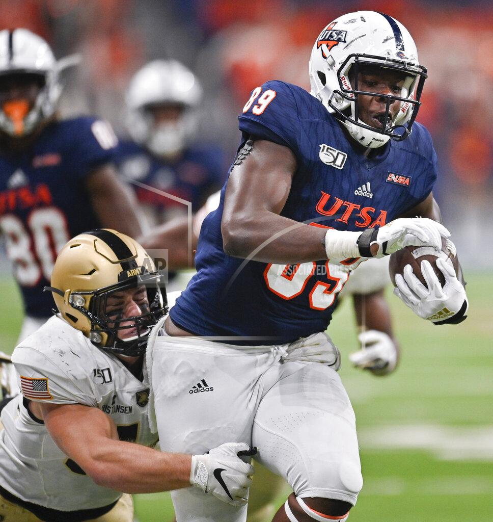 Darren Abate UTSA's Leroy Watson (89) is tackled by Army's Cole Christiansen during the second half of an NCAA college football game Saturday, Sept. 14, 2019, in San Antonio. (AP Photo/Darren Abate)