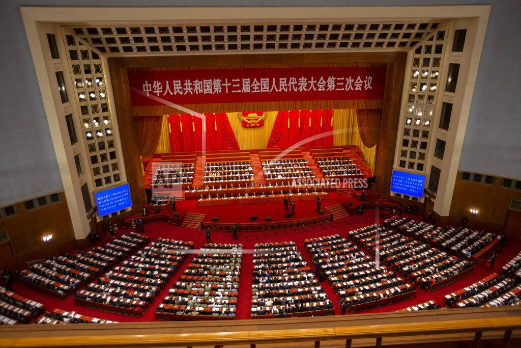 Mark Schiefelbein FILE - In this May 28, 2020, file photo, delegates and Chinese leaders attend the closing session of China's National People's Congress (NPC) in Beijing. The annual gathering of the National People's Congress and its advisory body, the Chinese People's Political Consultative Conference, brings handpicked delegates from across the country to discuss governing priorities and receive instructions from the ruling Communist Party leadership. (AP Photo/Mark Schiefelbein, File)