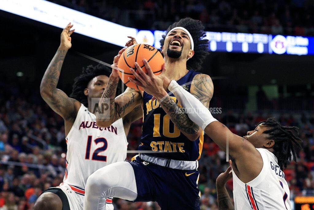 Butch Dill Murray State guard Tevin Brown (10) is fouled by Auburn guard Wendell Green Jr. (1) as he goes to the basket for a shot during the first half of an NCAA college basketball game Wednesday, Dec. 22, 2021 in Auburn, Ala. (AP Photo/Butch Dill)