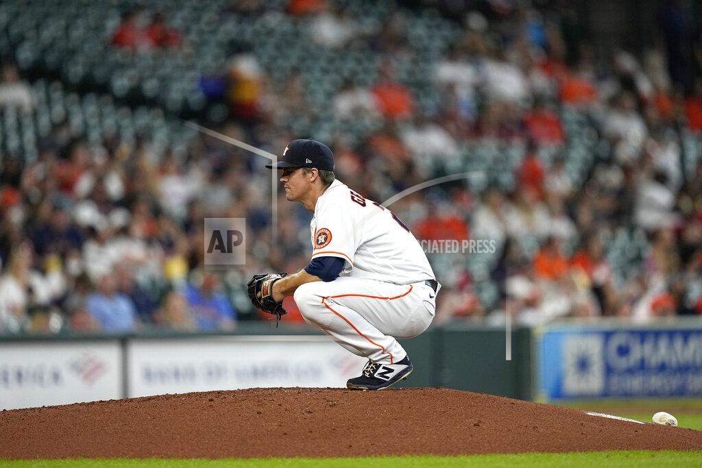 David J. Phillip Houston Astros starting pitcher Zack Greinke waits for the next batter after giving up a home run to Arizona Diamondbacks' Pavin Smith during the third inning of a baseball game Sunday, Sept. 19, 2021, in Houston. (AP Photo/David J. Phillip)