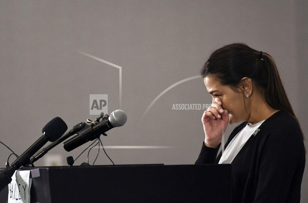 Matthew Dae Smith Bailey Kowalski cries as she speaks during a news conference in East Lansing, Mich., Thursday, April 11, 2019. The 22-year-old Michigan State University student is speaking publicly a year after suing the school, alleging that three former men's basketball players raped her in 2015 and that she was discouraged by counseling center staff from reporting what happened. (Matthew Dae Smith/Lansing State Journal via AP)