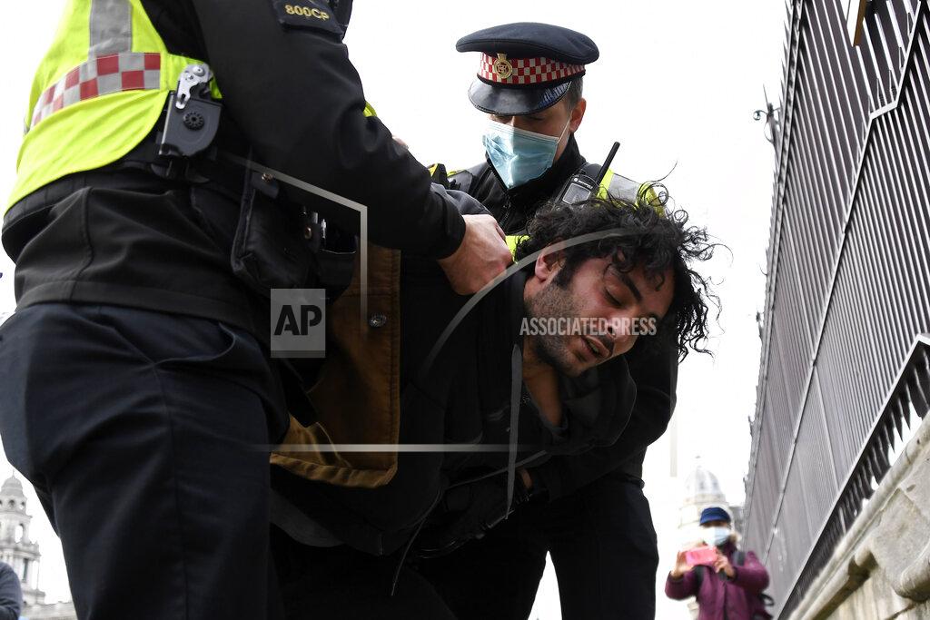 Alberto Pezzali Police detain a man for blocking traffic at Parliament Square during a 'Kill the Bill' protest in London, Saturday, April 3, 2021. The demonstration is against the contentious Police, Crime, Sentencing and Courts Bill, which is currently going through Parliament and would give police stronger powers to restrict protests. (AP Photo/Alberto Pezzali)