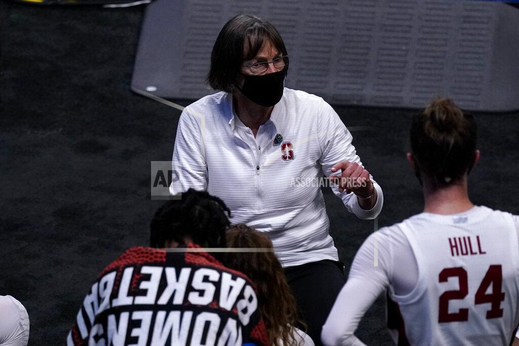 Stanford head coach Tara VanDerveer talks to her players during the second half of a college basketball game against Utah Valley in the first round of the women's NCAA tournament at the Alamodome in San Antonio, Sunday, March 21, 2021. (AP Photo/Charlie Riedel)
