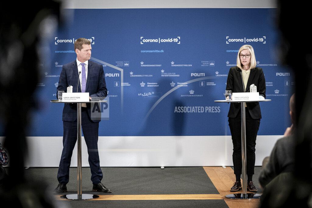 Soeren Brostroem, director of the National Board of Health, left and Tanja Erichsen, from the Danish Medicines Agency take part in a press briefing regarding the status of the AstraZeneca COVID-19 vaccine, in Copenhagen, Thursday, March 25, 2021. Danish officials have decided to extend their suspension of the AstraZeneca COVID-19 vaccine by three weeks while they continue evaluating the vaccine’s potential link with blood clots. Denmark first paused the use of the AstraZeneca vaccine as a precautionary measure on March 11. (Mads Claus Rasmussen/Ritzau Scanpix via AP)