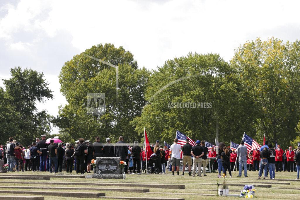 Nikos Frazier Mourners gather at Mount Hope cemetery for the funeral of Marine Cpl. Humberto "Bert" Sanchez, Tuesday, Sept. 14, 2021 in Logansport, Ind. Sanchez was one of 13 U.S. service members to die in an explosion during evacuation efforts in Afghanistan. (Nikos Frazier/Journal & Courier via AP)