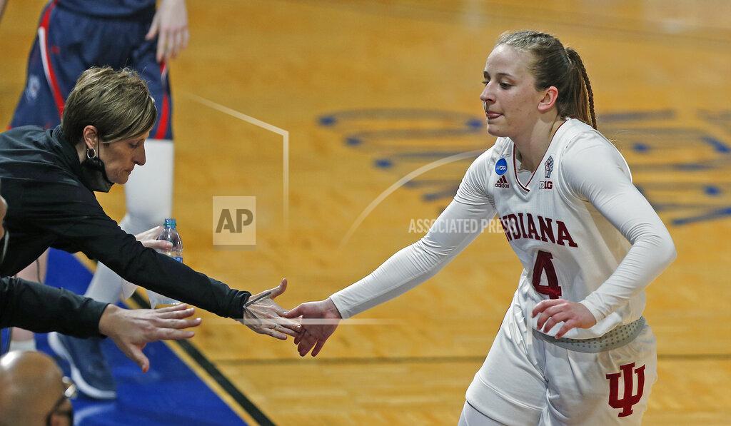 Ronald Cortes Indiana guard Nicole Cardano-Hillary is greeted by Indiana head coach Teri Moren during the second half of a college basketball game against Belmont in the second round of the women's NCAA tournament at the Greehey Arena in San Antonio on Wednesday, March 24, 2021. Indiana defeated Belmont 70-48. (AP Photo/Ronald Cortes)