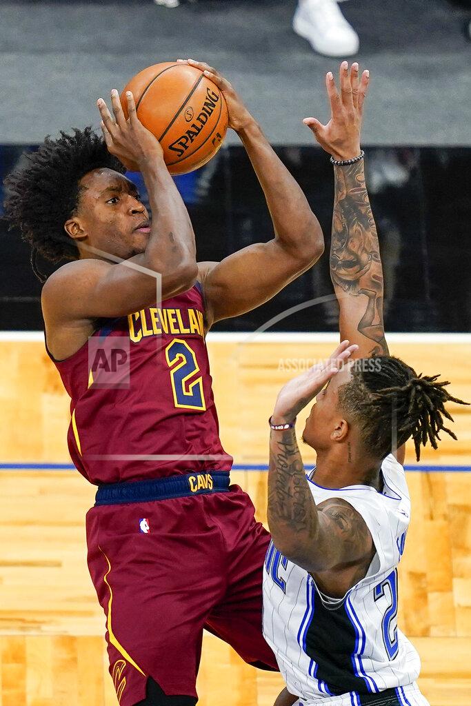 John Raoux Cleveland Cavaliers guard Collin Sexton (2) makes a shot over Orlando Magic guard Markelle Fultz, right, during the first half of an NBA basketball game, Monday, Jan. 4, 2021, in Orlando, Fla. (AP Photo/John Raoux)