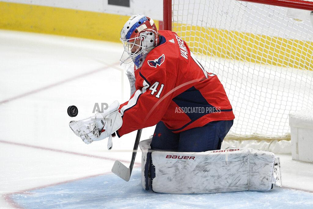 Nick Wass Washington Capitals goaltender Vitek Vanecek (41) stops the puck during the first period of an NHL hockey game against the Boston Bruins, Saturday, Jan. 30, 2021, in Washington. (AP Photo/Nick Wass)
