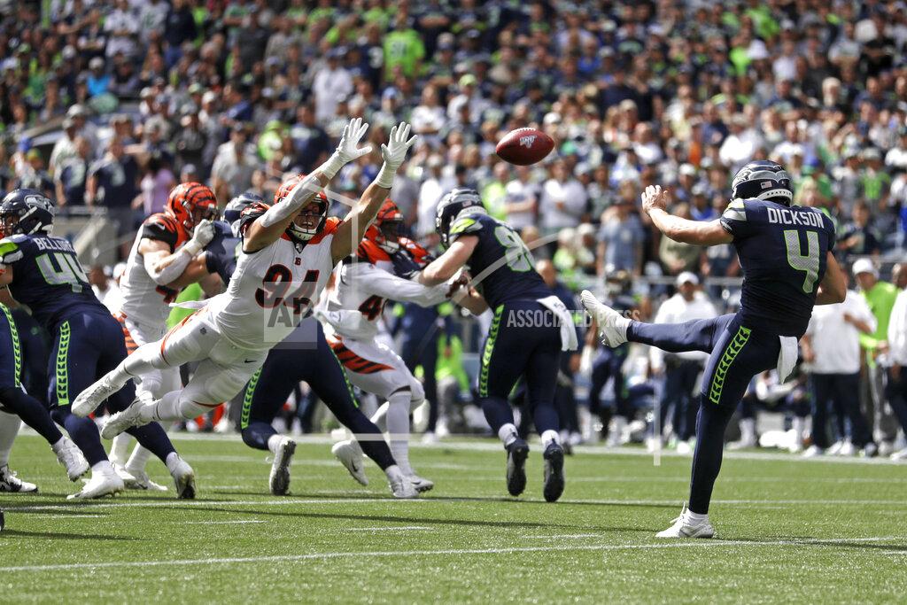 Stephen Brashear Seattle Seahawks punter Michael Dickson (4) kicks as Cincinnati Bengals defensive end Sam Hubbard (94) attempts the block during the first half of an NFL football game Sunday, Sept. 8, 2019, in Seattle. (AP Photo/Stephen Brashear)
