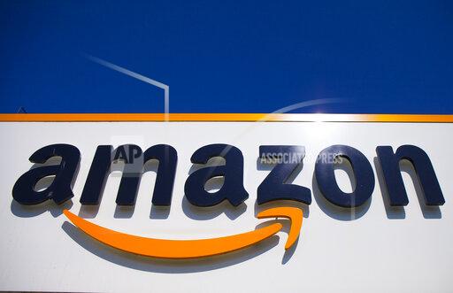 FILE - A view of the Amazon logo is displayed in Douai, northern France, April 16, 2020. Italy’s anti-trust authority on Thursday, Dec. 9, 2021 fined Amazon 1.13 billion euros, accusing it of exploiting its dominant position against third-party sellers on its site in such areas as logistics and product promotion in violation of EU competition rules. (AP Photo/Michel Spingler, File)