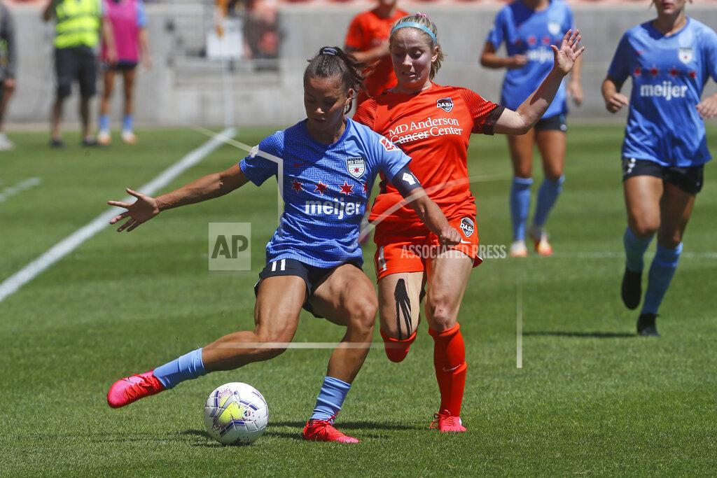 Rick Bowmer Chicago Red Stars' Sarah Gorden, front, plays the ball as Houston Dash's Bri Visalli defends during the second half of an NWSL Challenge Cup soccer finals match on July 26, 2020, in Sandy, Utah. Gordon aims to go beyond the social media statements, the T-shirts and the platitudes, and do something to lift up Black lives. The 28-year-old has put her focus on mental health for young women of color in launching her nonprofit organization, HoodSpace. (AP Photo/Rick Bowmer)