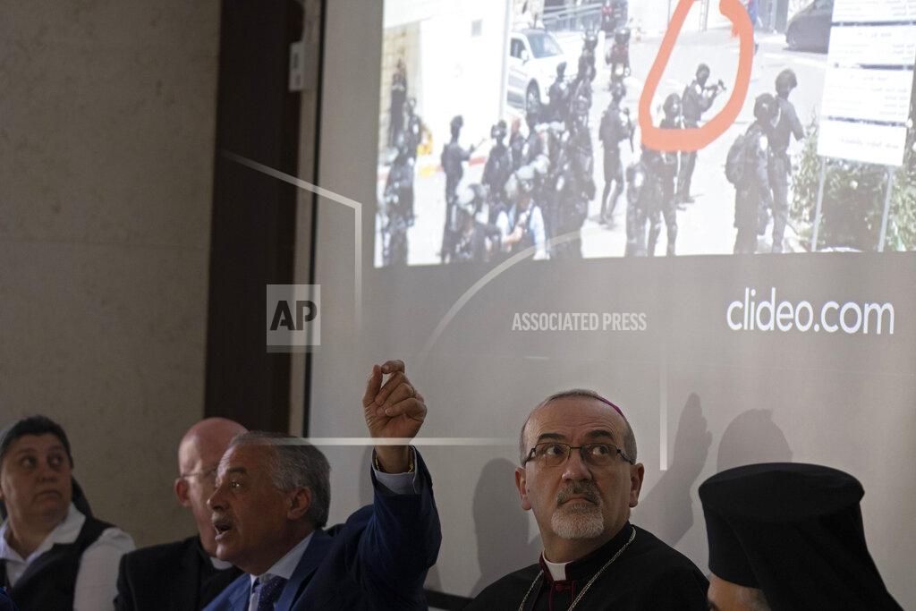 Maya Alleruzzo The Latin Patriarch of Jerusalem Pierbattista Pizzaballa looks up at a video of Israeli police in riot gear during the funeral of slain Al Jazeera correspondent Shireen Abu Akleh on Friday, during a press conference about police violence against pallbearers at the funeral, in east Jerusalem, Monday, May 16, 2022. Pizzaballa, the top Catholic clergyman in the Holy Land, said Israel's police attack on mourners during a funeral for Abu Akleh was a violation of human rights and disrespected the Catholic Church. (AP Photo/ Maya Alleruzzo)